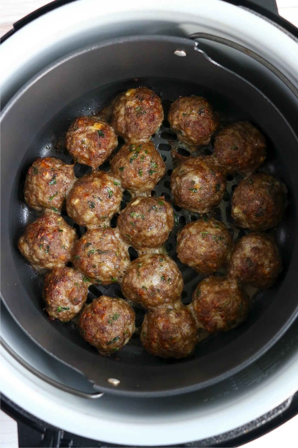 cooked meatballs in Ninja Foodi air crisp basket