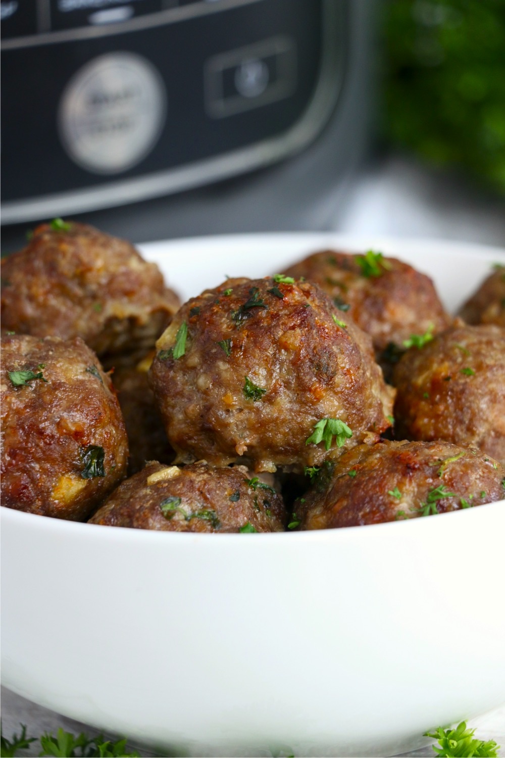 bowl of meatballs in front of Ninja Foodi