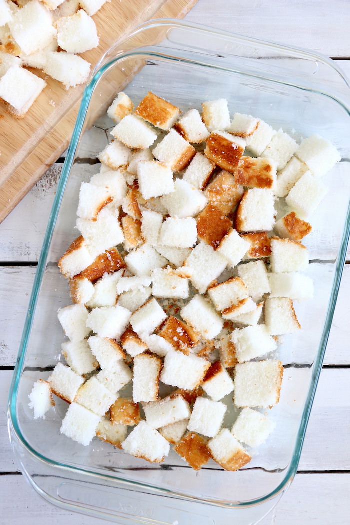 No Bake Cherry Dump Cake - An easy, no-bake cherry trifle dessert with layers of angel food cake, sour cream, pudding, cherry pie filling and whipped topping.