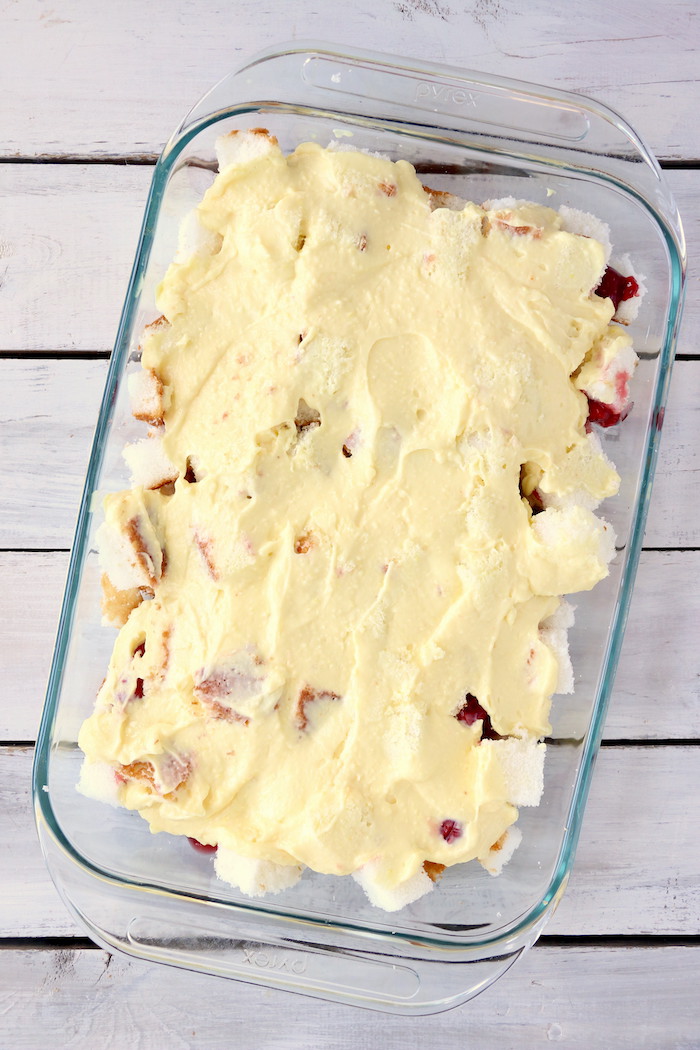 No Bake Cherry Dump Cake - An easy, no-bake cherry trifle dessert with layers of angel food cake, sour cream, pudding, cherry pie filling and whipped topping.