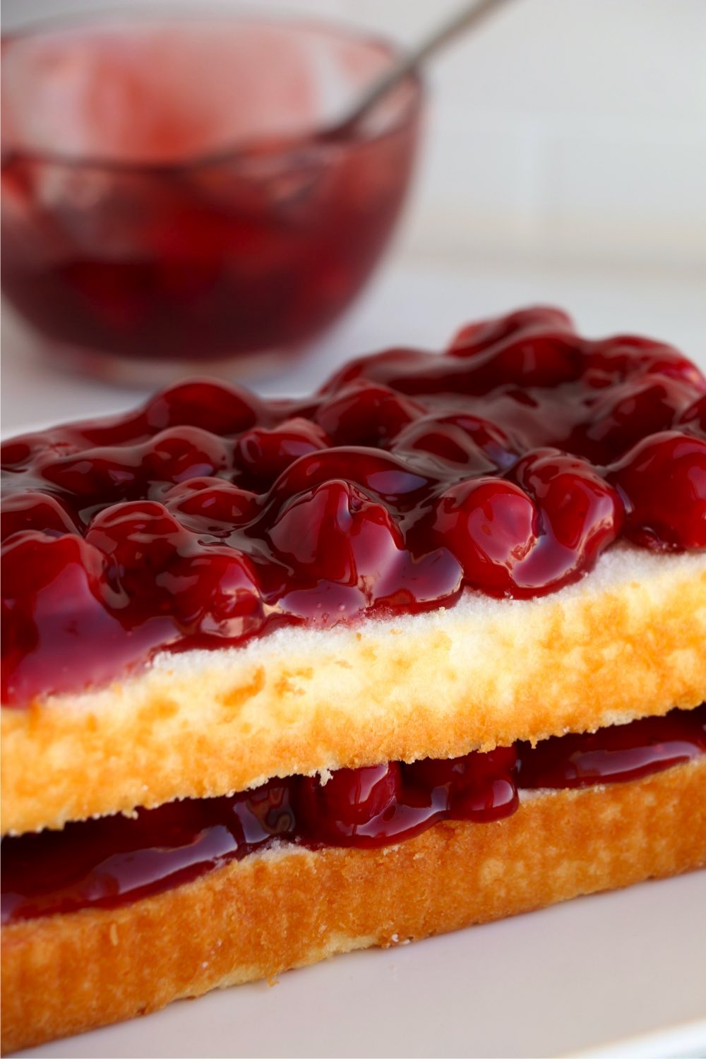 cherry pie filling on top of pound cake layers