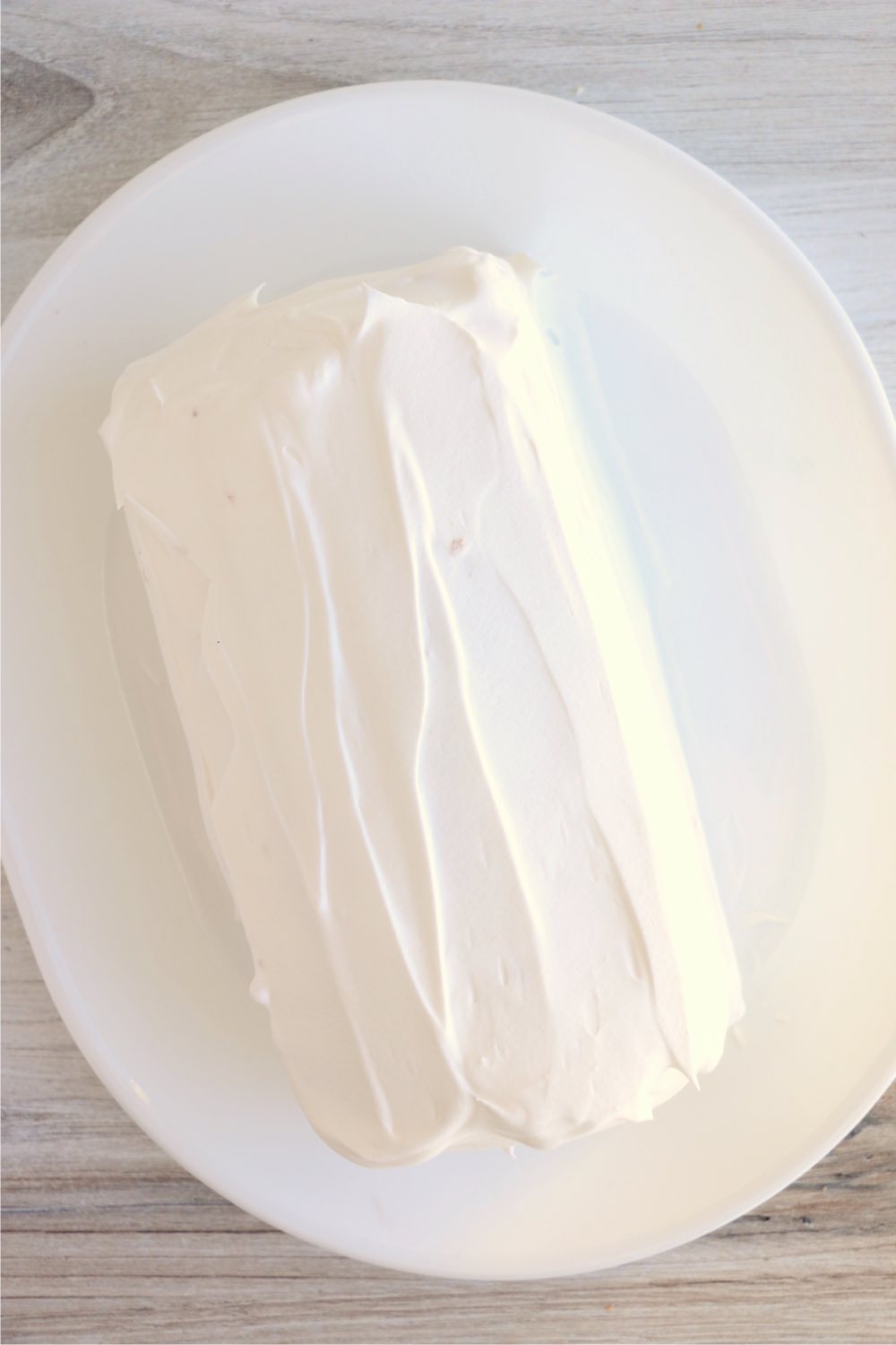 Pound cake covered in whipped topping