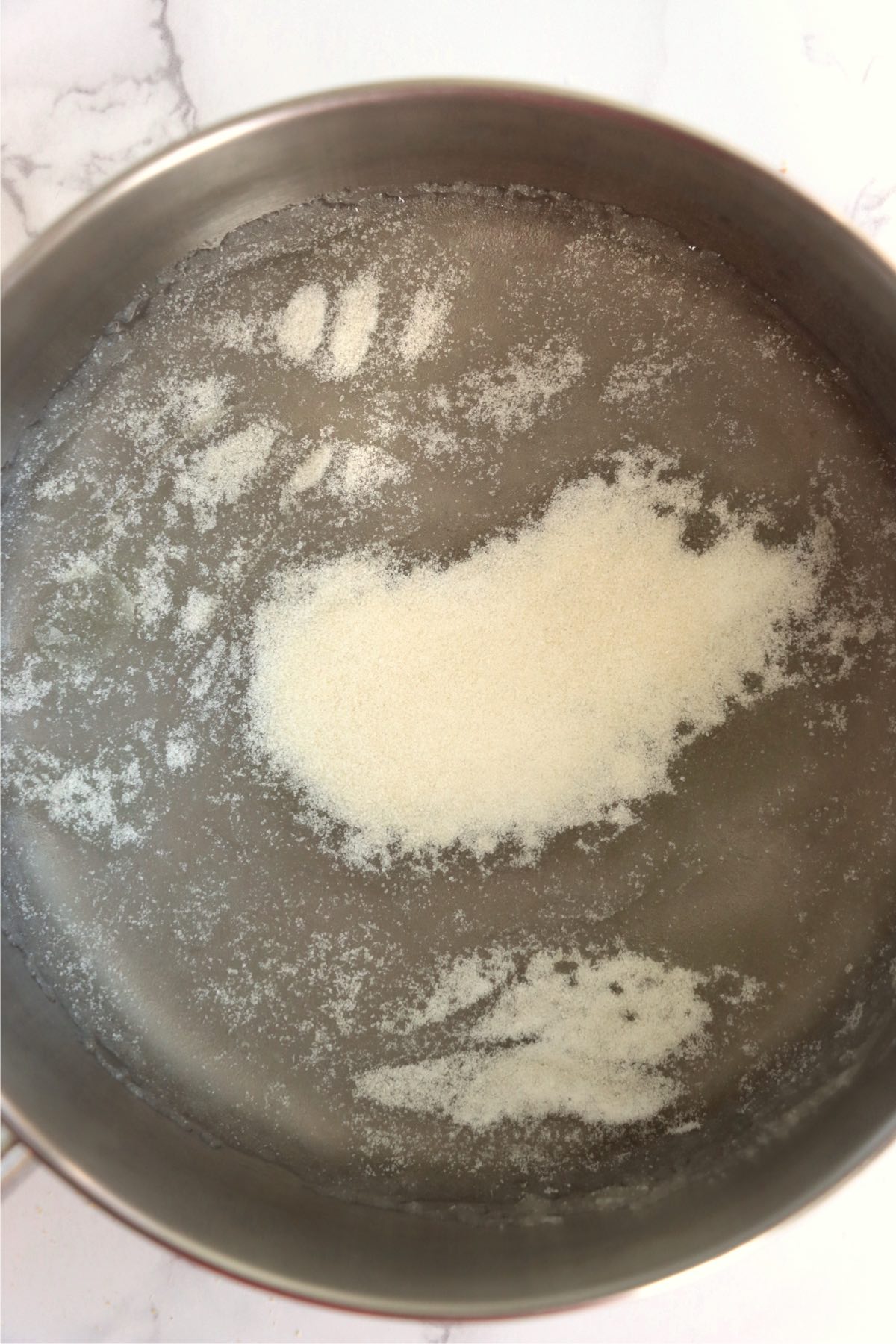 Gelatin in a pot of boiling water