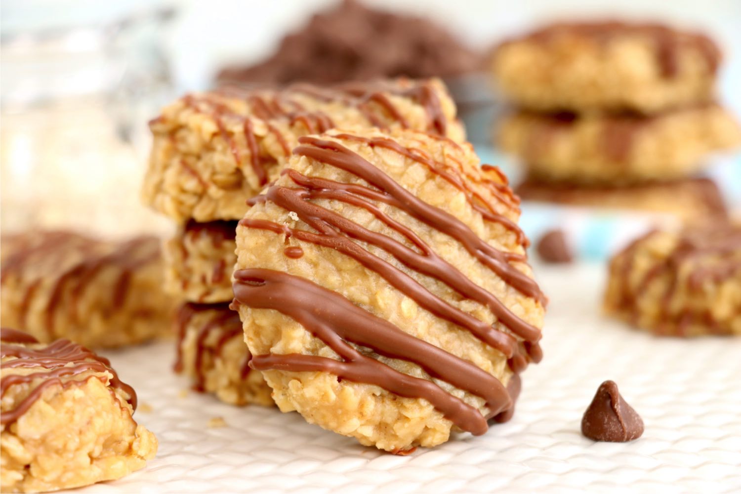 chocolate drizzled preacher cookie in front of stack of cookies