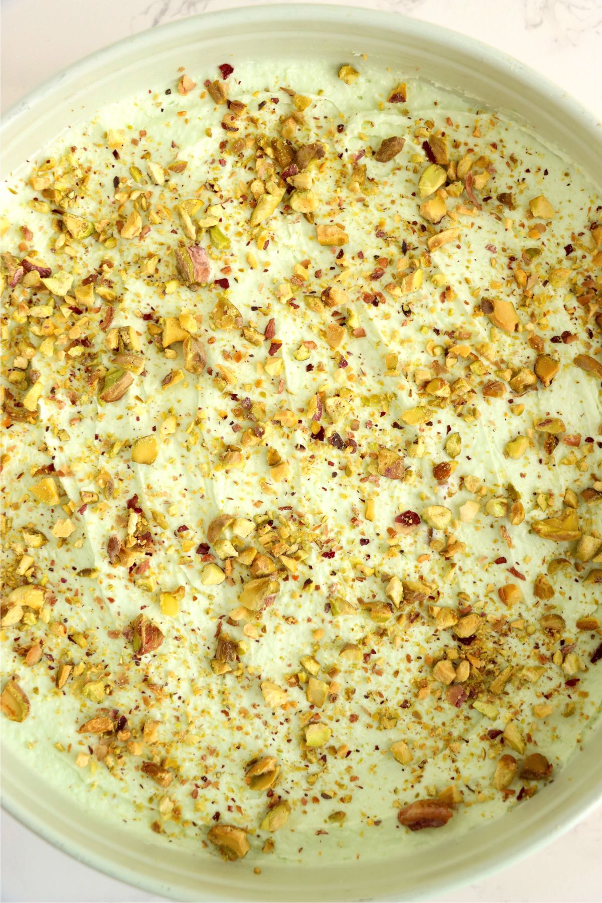 Crushed pistachio covered cheesecake