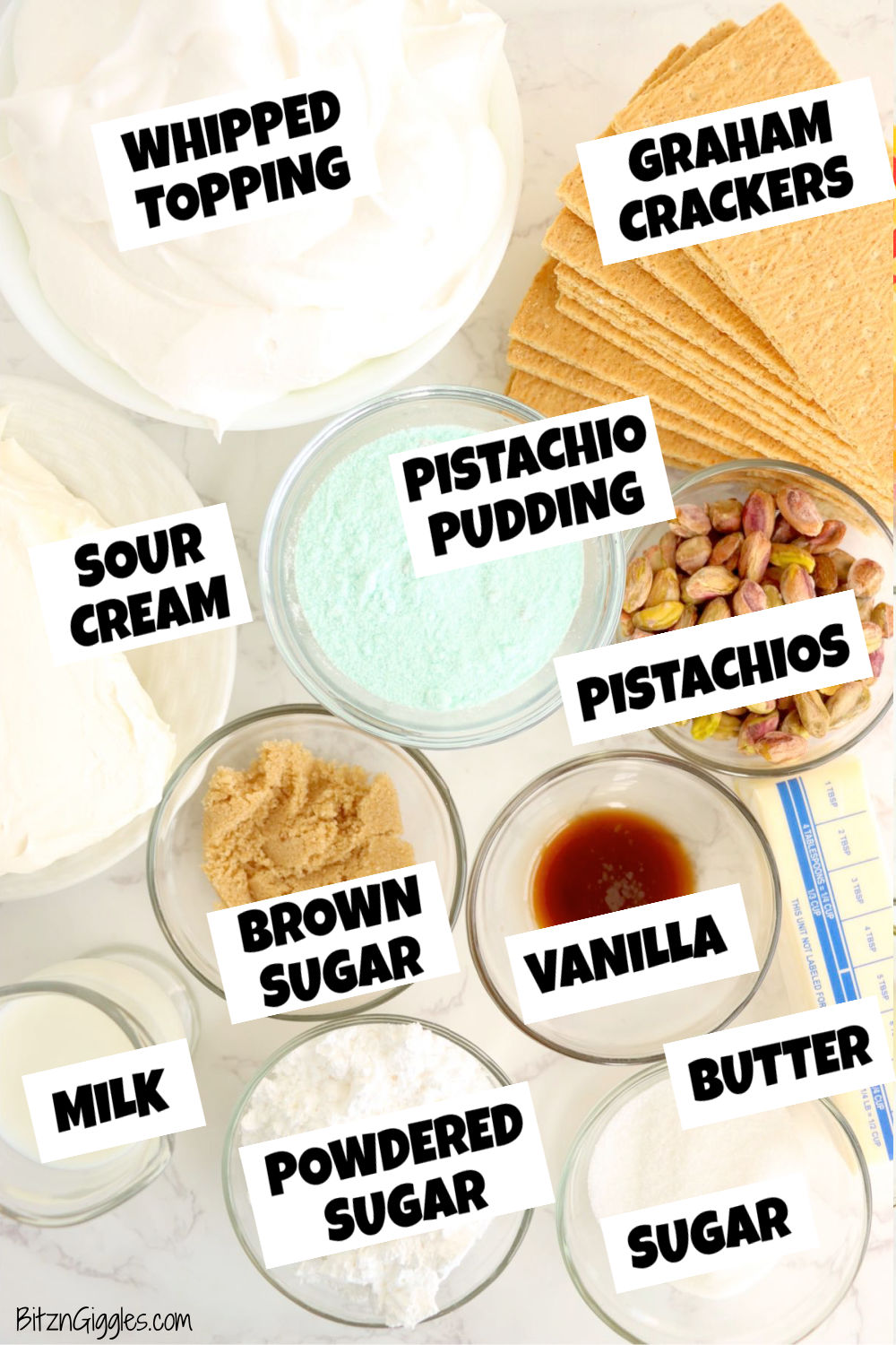Ingredients for pistachio cheesecake all laid out on a table