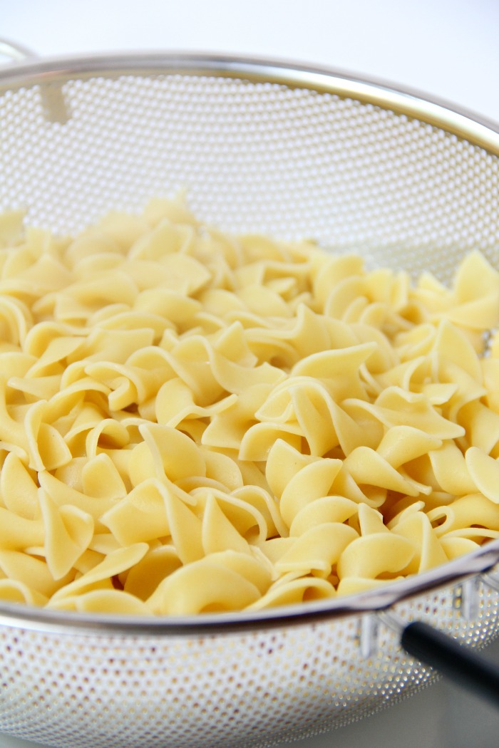 Classic Tuna Noodle Casserole - Ready in under 45 minutes, this classic and comforting casserole features tuna, onions, mushrooms, peas and cheese in a creamy sauce topped with more cheese and crunchy French fried onions! So flavorful, and sure to satisfy the entire family!