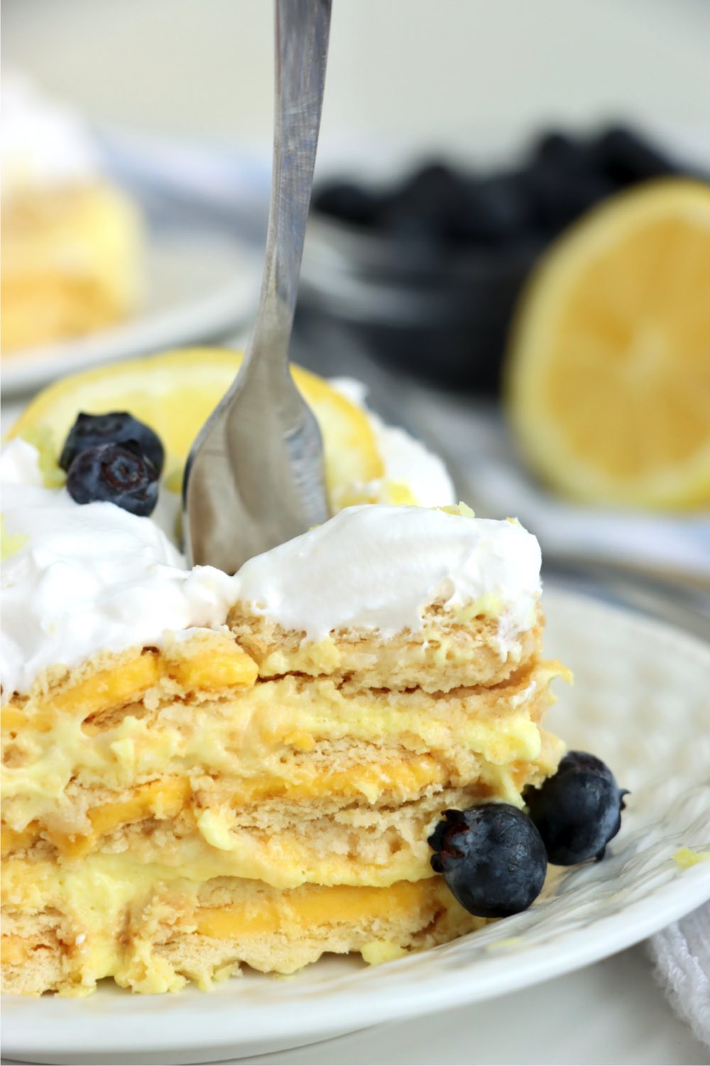 fork digging into a piece of layered cake