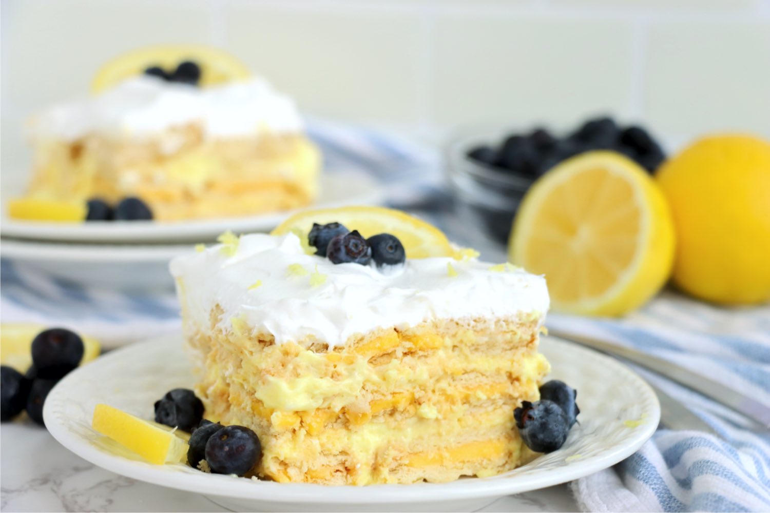 piece of lemon icebox cake garnished with blueberries