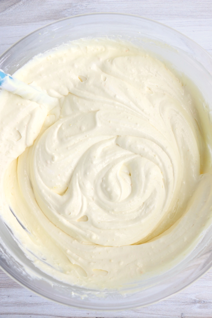 Mixing vanilla pudding and Cool Whip