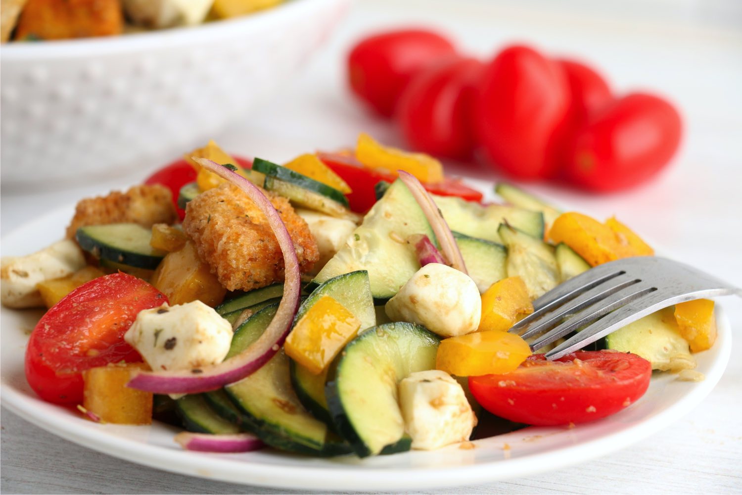 bright colorful salad on a white plate