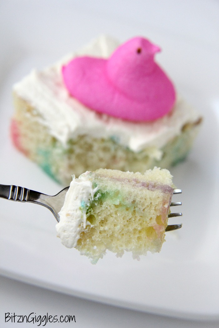 Peeps Cake With Marshmallow Frosting - This cake incorporates bits of Peeps right into the baking process, producing a colorful and slightly sweetened cake with a fluffy, marshmallow frosting that literally melts in your mouth!