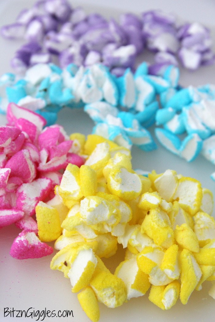 Peeps Cake With Marshmallow Frosting - This cake incorporates bits of Peeps right into the baking process, producing a colorful and slightly sweetened cake with a fluffy, marshmallow frosting that literally melts in your mouth!