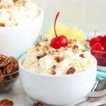 small white bowl of sweet pina colada fluff salad