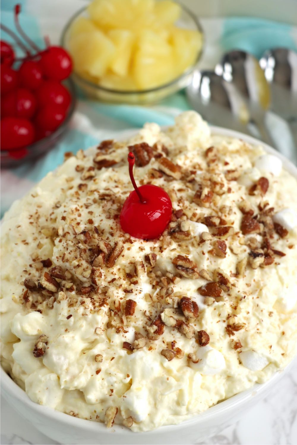 bowl of fruit salad with whipped topping