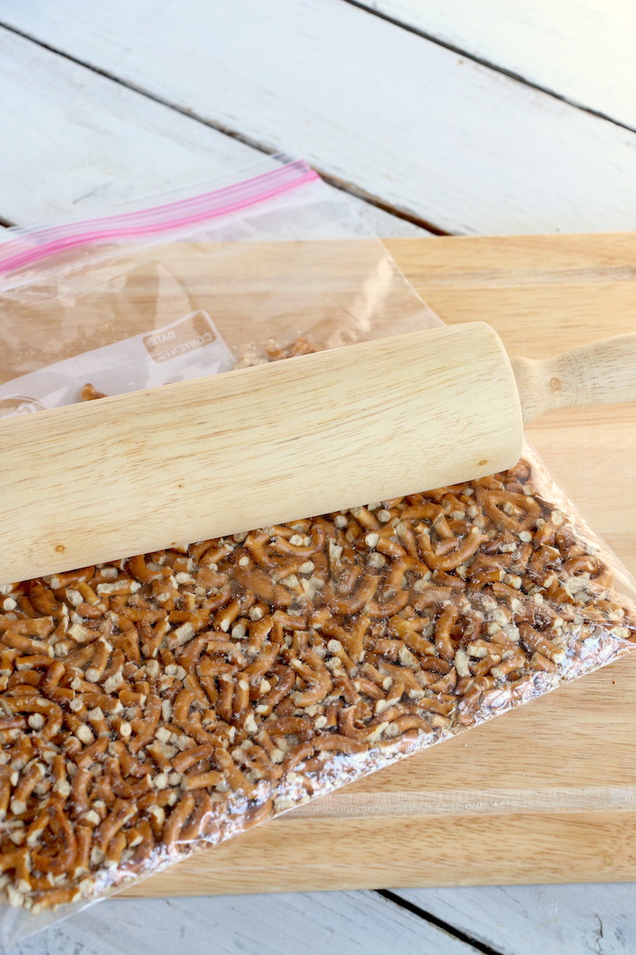 Pineapple Pretzel Salad - This cool, creamy pineapple fluff filled with candied pretzels is the perfect combination of sweet and salty, and can be served as a dessert or sweet side dish!Â