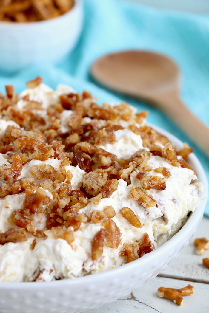 Pineapple Pretzel Salad - This cool, creamy pineapple fluff filled with candied pretzels is the perfect combination of sweet and salty, and can be served as a dessert or sweet side dish!Â