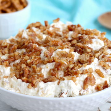 Pineapple Pretzel Salad - This cool, creamy pineapple fluff filled with candied pretzels is the perfect combination of sweet and salty, and can be served as a dessert or sweet side dish! 