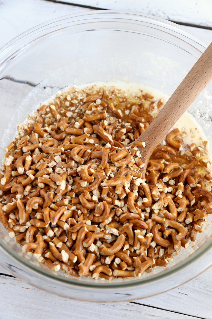 Pineapple Pretzel Salad - This cool, creamy pineapple fluff filled with candied pretzels is the perfect combination of sweet and salty, and can be served as a dessert or sweet side dish!Â