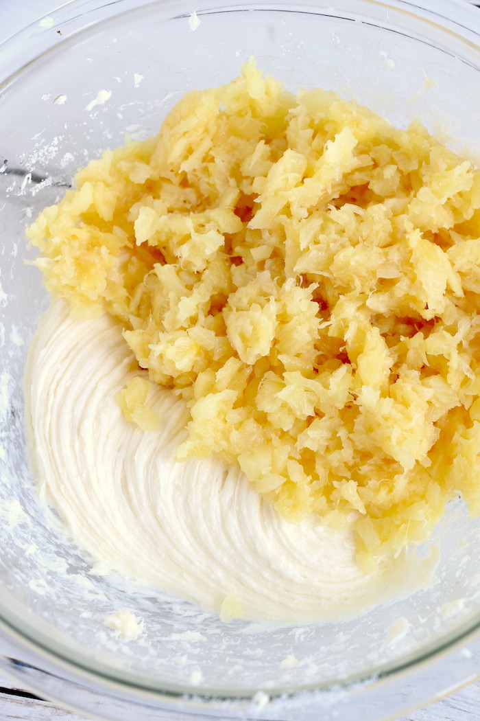 Pineapple Pretzel Salad - This cool, creamy pineapple fluff filled with candied pretzels is the perfect combination of sweet and salty, and can be served as a dessert or sweet side dish!Â