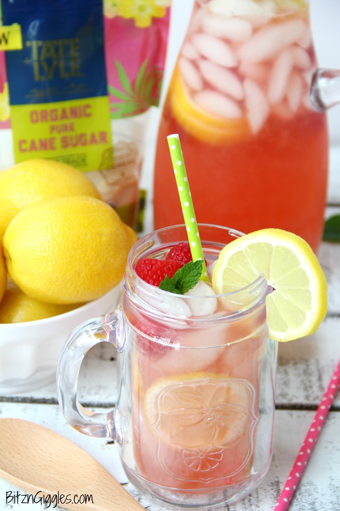 Pink Lemonade - Homemade pink lemonade made with fresh raspberries and lemons! So easy and so refreshing and delicious for a baby shower, summer party or picnic!