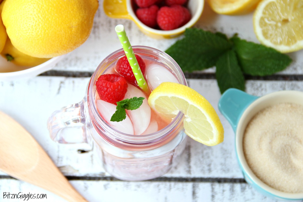 Pink Lemonade - Homemade pink lemonade made with fresh raspberries and lemons! So easy and so refreshing and delicious for a baby shower, summer party or picnic!
