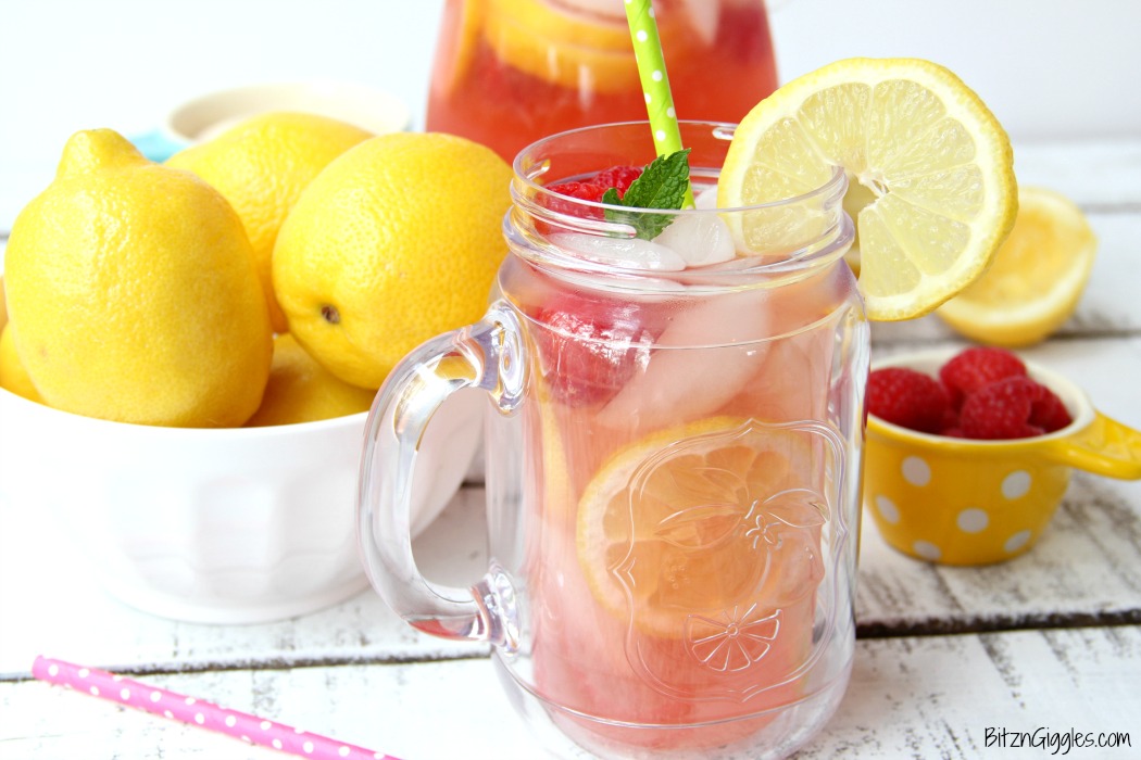 Pink Lemonade - Homemade pink lemonade made with fresh raspberries and lemons! So easy and so refreshing and delicious for a baby shower, summer party or picnic!