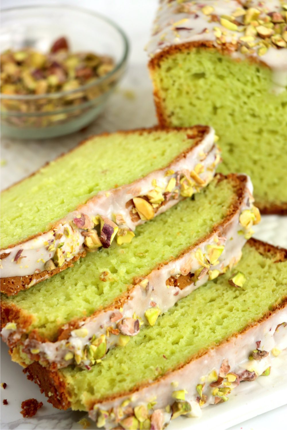 Slices of pistachio bread with icing