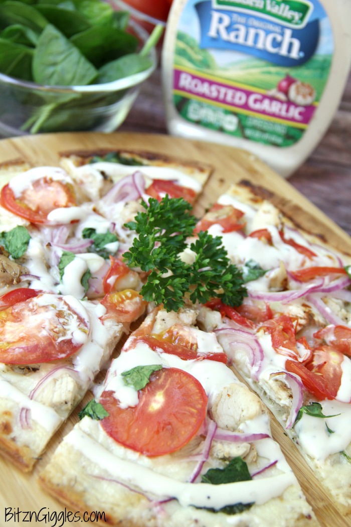 Chicken Ranch Tortilla Pizza - A quick and delicious "skinny" pizza with sprinkles of grilled chicken and fresh vegetables, bursting with mouth-watering garlic and ranch flavors!