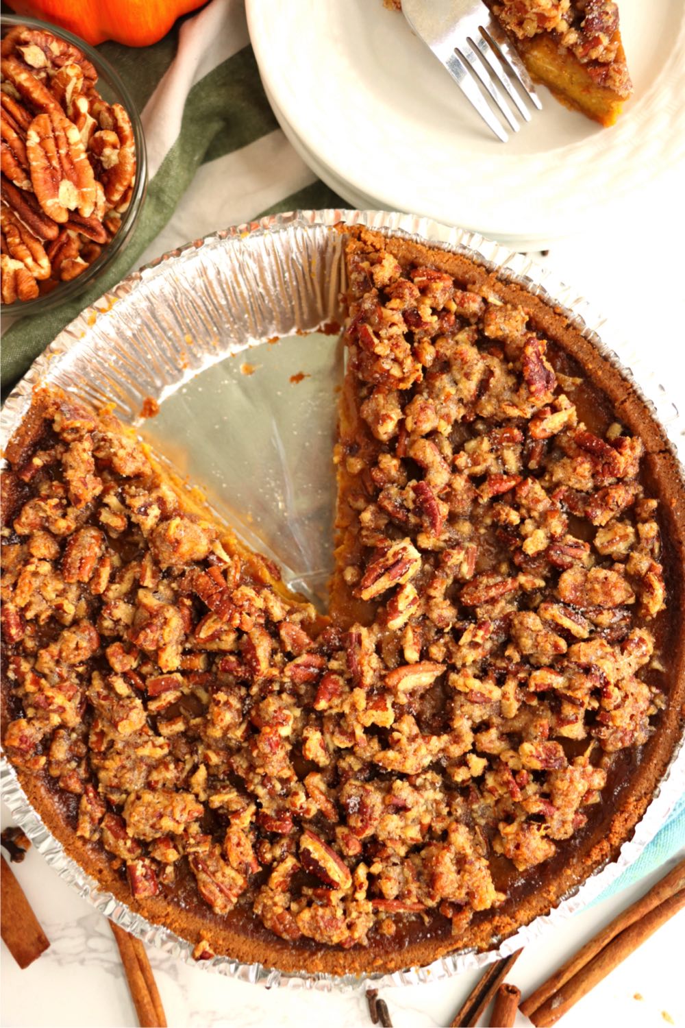 praline topped pumpkin pie with piece out