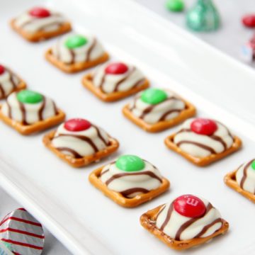 Pretzel M&M Hugs- Sweet and salty three-ingredient bite-sized treats perfect for Christmas and the holidays!