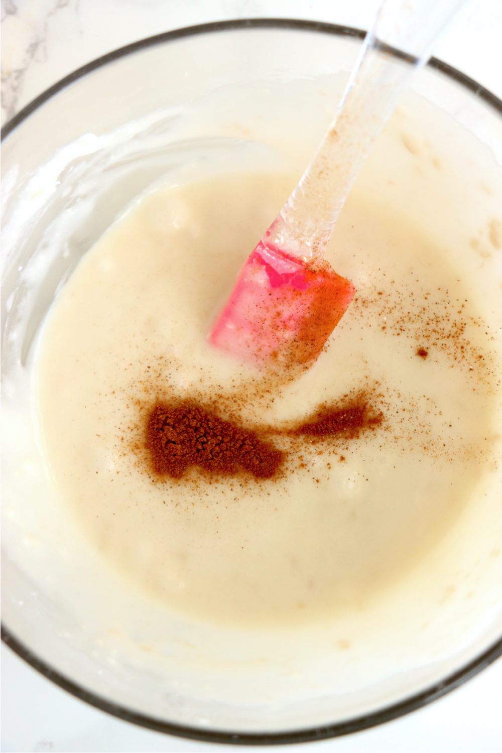 mixing together ingredients for cookie icing