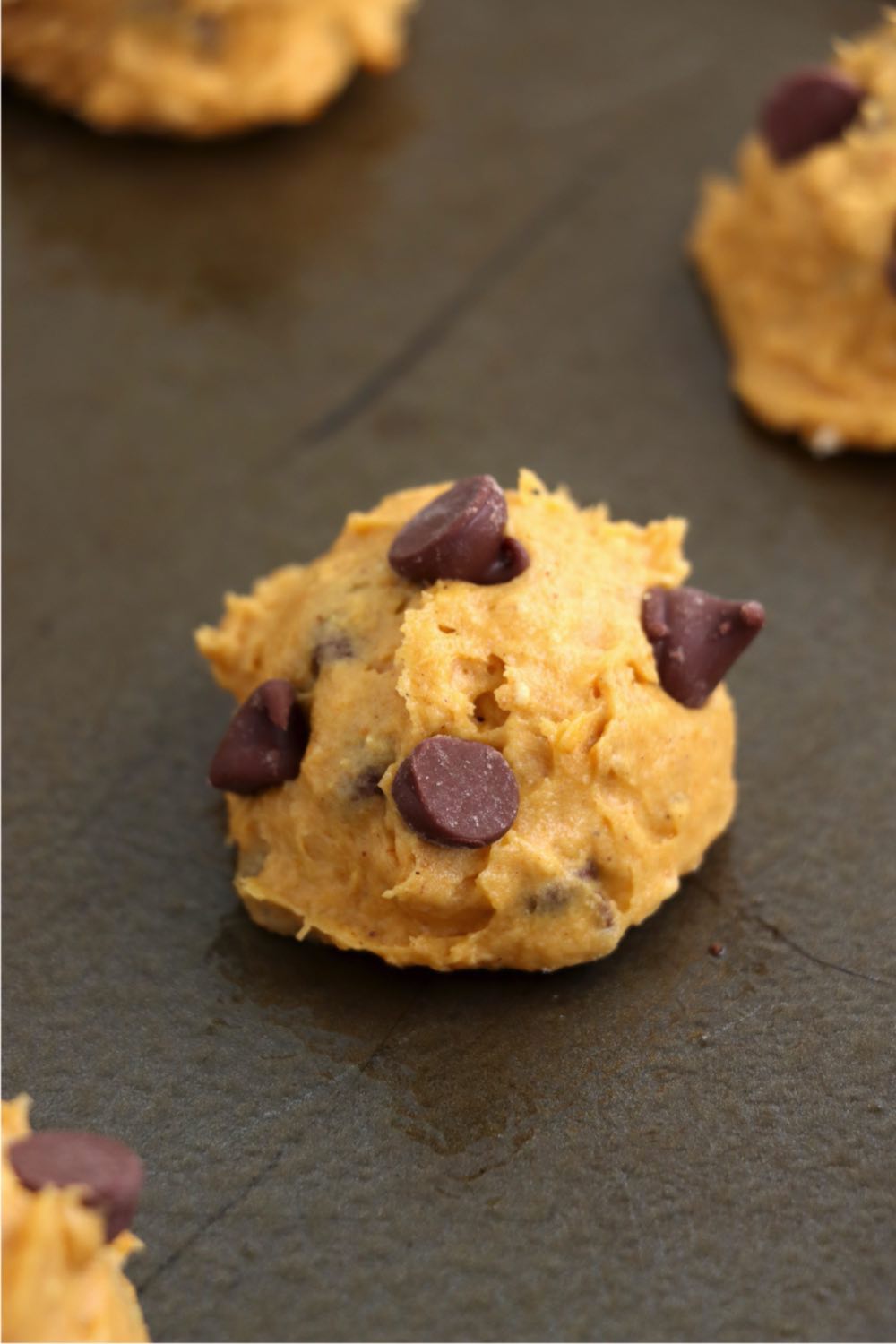 pumpkin chocolate chip cookie dough on baking sheet