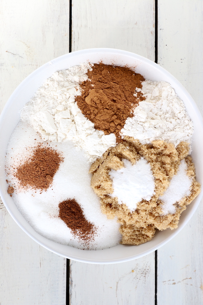 Pumpkin Chocolate Chip Muffins - Homemade pumpkin muffins sprinkled with fall spices and lots of chocolate chips!