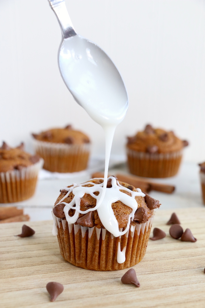 Pumpkin Chocolate Chip Muffins - Homemade pumpkin muffins sprinkled with fall spices and lots of chocolate chips!