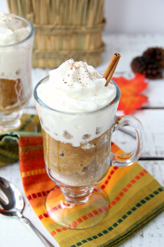 Pumpkin Mug Cake - A quick and easy microwave pumpkin mug cake. Topped with whipped cream and a cinnamon stick, this is the ultimate simple fall dessert!