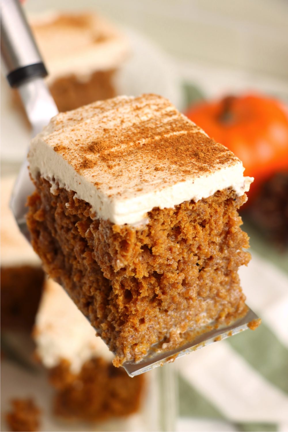 cake server holding a piece of poke cake