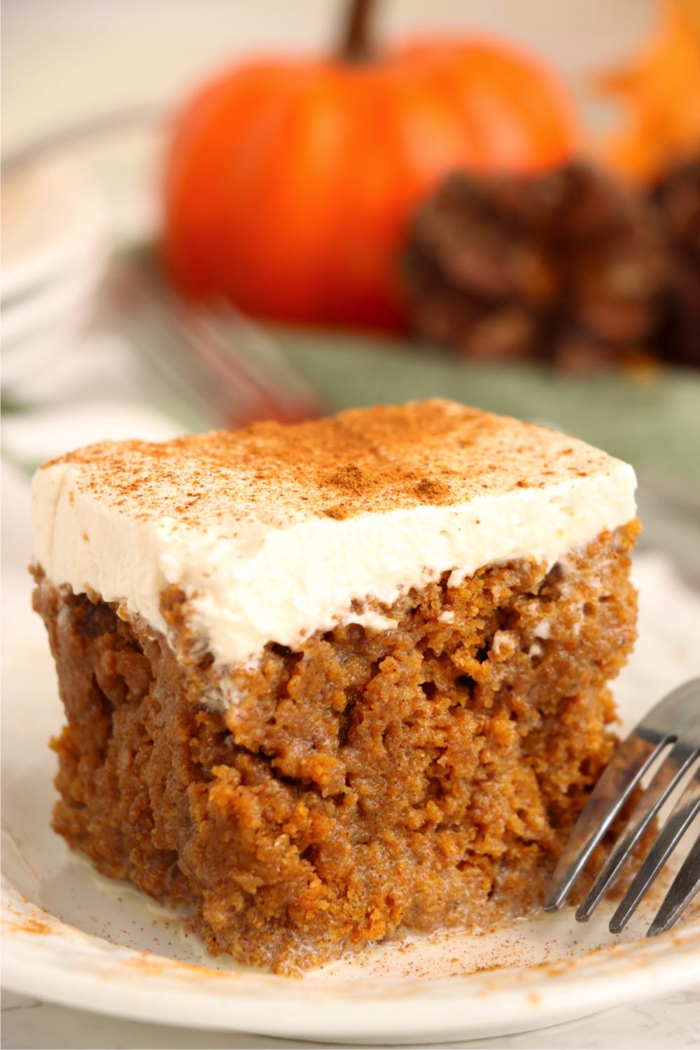 fork next to a piece of pumpkin cake