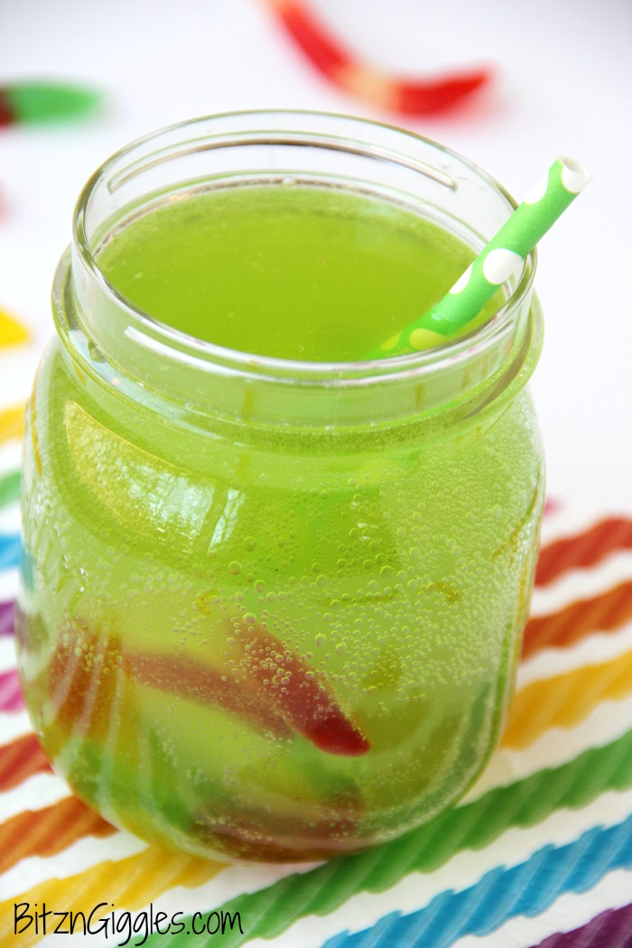 Gummy Worm Punch - Kids will love sipping on this drink in the summer! Great idea for birthday parties, St. Patrick's Day and Halloween, too! Gummy worms are frozen in a punch mixture and emerge from the ice as the drink is enjoyed! So much fun!