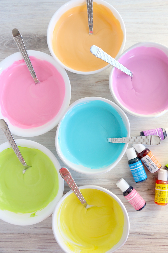 six bowls filled with colored ice cream