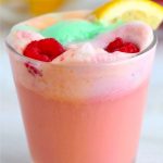 glass filled with pink sherbet punch