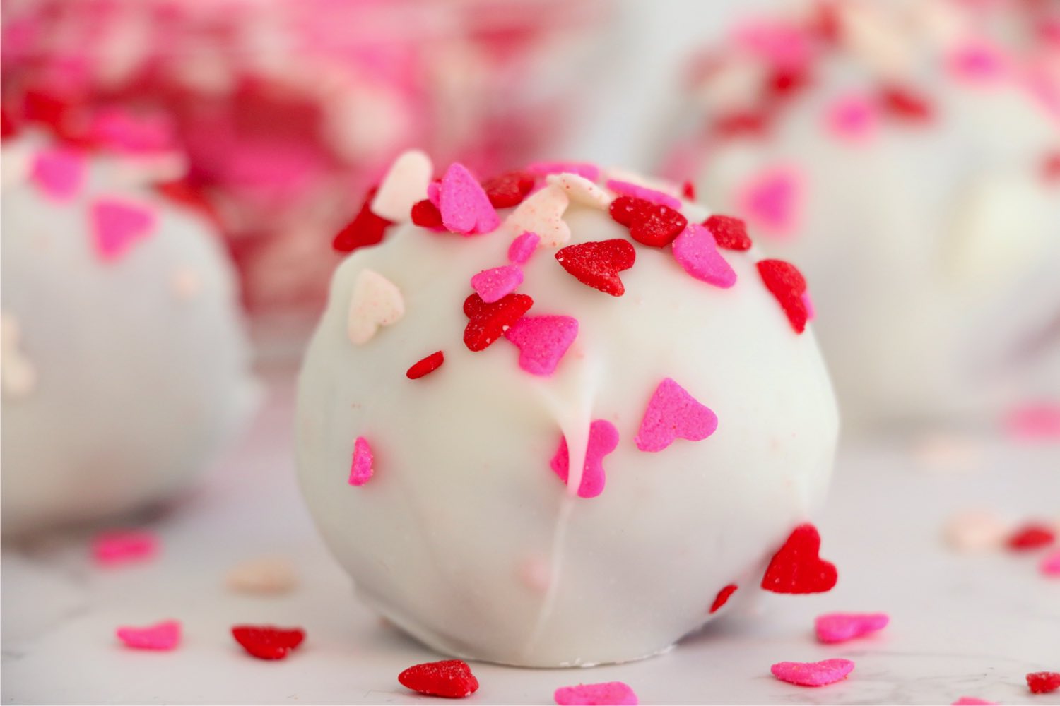 close up of a red velvet bourbon cake ball
