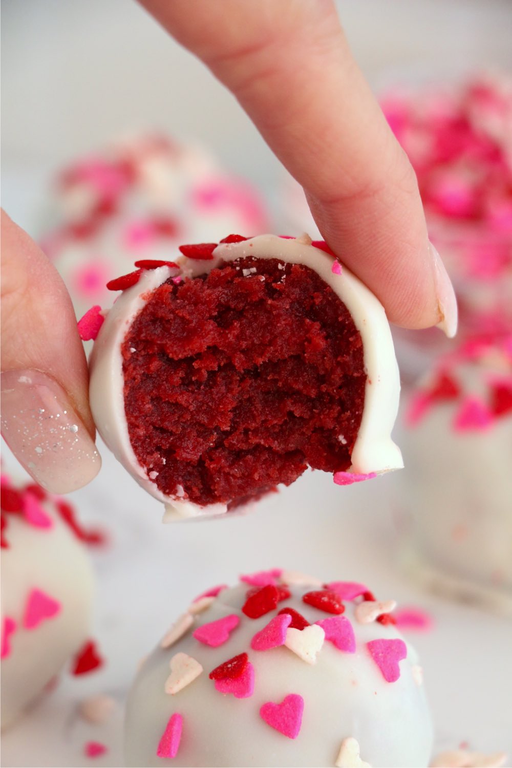 picking up a red velvet truffle