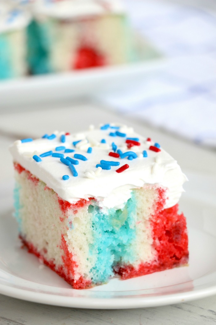 Red White and Blue Jello Poke Cake - A colorful and delicious cake, perfect for Memorial Day, the 4th of July or any patriotic celebration! The Jello is what makes it super moist!