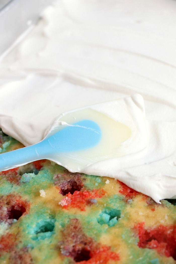 Red White and Blue Jello Poke Cake - A colorful and delicious cake, perfect for Memorial Day, the 4th of July or any patriotic celebration! The Jello is what makes it super moist!