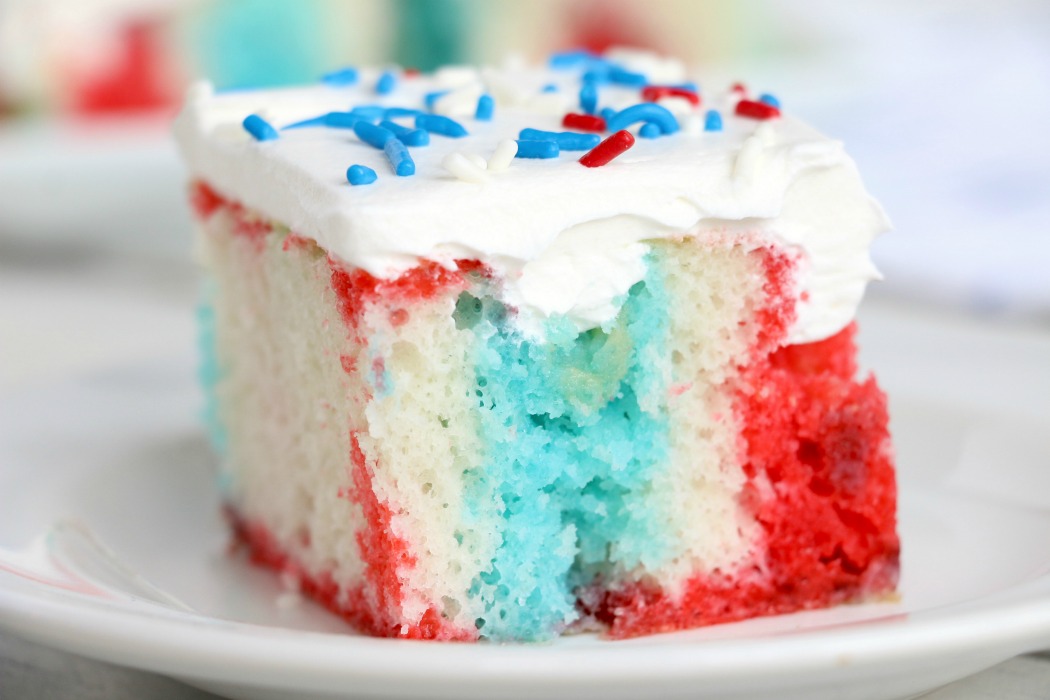 Red White and Blue Jello Poke Cake - A colorful and delicious cake, perfect for Memorial Day, the 4th of July or any patriotic celebration! The Jello is what makes it super moist!