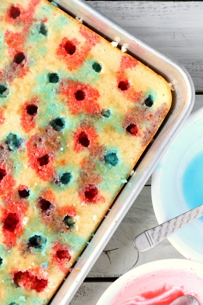 Red White and Blue Jello Poke Cake - A colorful and delicious cake, perfect for Memorial Day, the 4th of July or any patriotic celebration! The Jello is what makes it super moist!