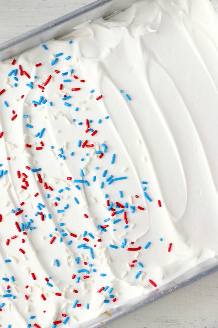 Red White and Blue Jello Poke Cake - A colorful and delicious cake, perfect for Memorial Day, the 4th of July or any patriotic celebration! The Jello is what makes it super moist!