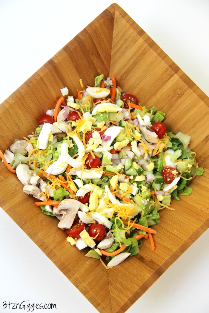 A delicious, crisp chopped salad with loads of fresh veggies, perfect for serving up in the summer after a visit to the farmer's market!