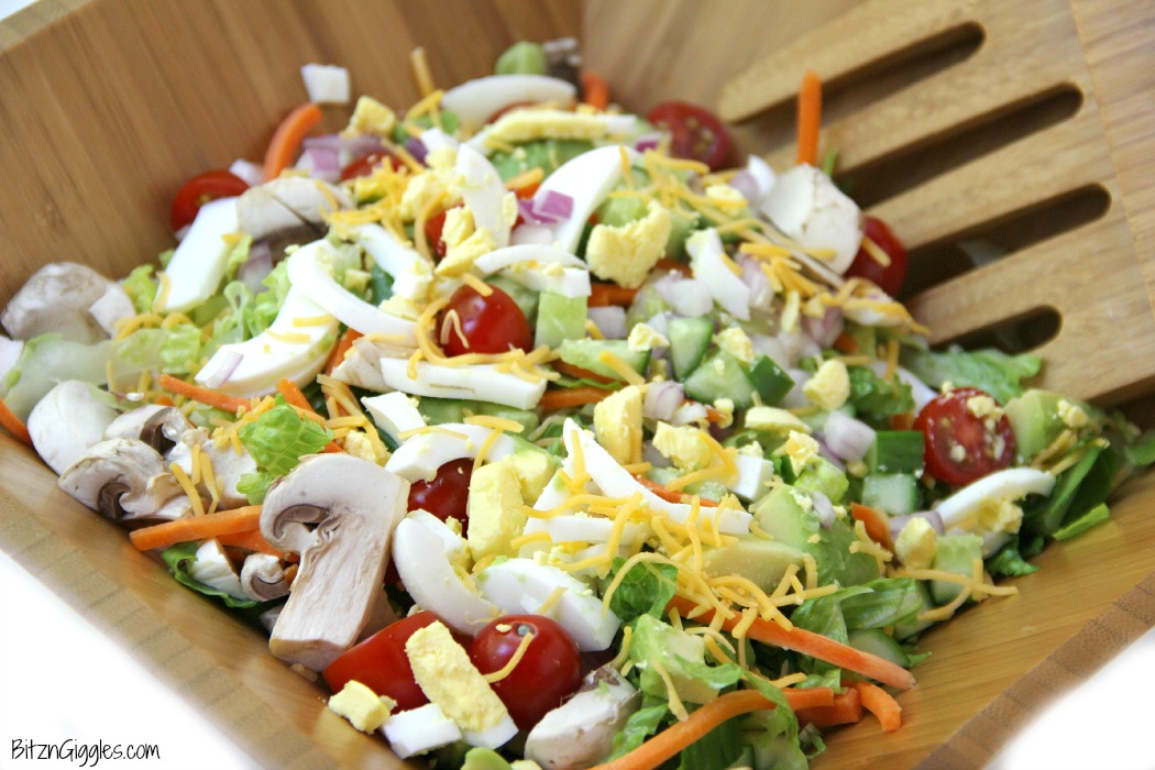 A delicious, crisp chopped salad with loads of fresh veggies, perfect for serving up in the summer after a visit to the farmer's market!